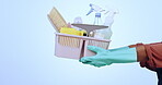 Person, hands and bucket of cleaning supplies, detergent or equipment against a studio background. Closeup of cleaner showing tools in domestic service, hygiene or germ and bacteria removal on mockup