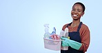 Woman, smile and hold for cleaning supplies in studio for mockup on blue background for housework, service or hygiene. Cleaner, person or maid with excitement for promotion, announcement or discount