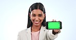 Business woman, phone and green screen in marketing or advertising against a studio background. Portrait of happy female person or employee smile showing mobile smartphone app display or mockup space