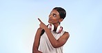 Fitness, pointing and young woman in a studio by mockup space for advertising or marketing. Sports, mock up and Indian female model athlete with show hand gesture isolated by white background.