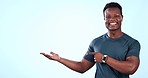 Exercise, happy black man or point at palm product placement, gym studio notification or sport commercial. Athlete portrait, mockup space and African runner advertising sales deal on blue background