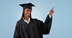 Happy woman, graduation and pointing to list in advertising or marketing against a studio background. Portrait of female person, student or graduate smile showing steps or information on mockup space