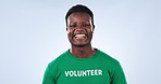 Volunteer, face and happy black man for charity outreach project, studio pollution support or non profit social responsibility. Smile, volunteering commitment or NGO model portrait on blue background