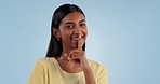 Woman, secret and face with gossip, drama and privacy emoji hand sign in studio. Female person, lips and whisper for opinion and confidential announcement with news and model with blue background