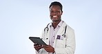 Tablet, doctor and face of black man in studio for medical service, care and online support. Healthcare, smile and portrait of person on digital tech for website, research and help on blue background