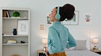 Black woman, dance and headphone music in bedroom to relax, feel good or celebrate success. Wellness, streaming and dancing girl happy and satisfied with playlist audio for home relaxation.

