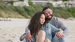 Love, hug and couple on a beach, smile and relax on summer vacation, bonding and romance. Partners, man or woman with happiness, embrace and seaside holiday with romance, quality time and anniversary