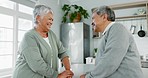 Senior couple, conversation and laughing in home with love, care and quality time together in retirement. Old man, happy woman and talking about funny story, discussion and joke to relax in apartment