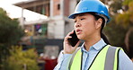 Asian woman, architect and phone call in construction, communication or planning in conversation on site. Female person, engineer or contractor talking on mobile smartphone in architecture discussion