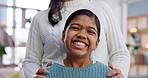 Home, happy and face of girl with mother for bonding, relaxing and fun together in living room. Family, love and portrait of excited young child with parent for healthy relationship, trust and care