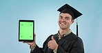 Graduation student, thumbs up and tablet green screen or presentation for college or e learning in studio. Face of man or graduation on digital mockup or education tracking marker on blue background