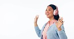 Woman, dance and music headphones in studio for celebration of freedom, party or hearing audio on white background. Asian model listening to media podcast, sound or radio subscription at mockup space