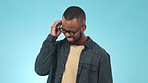 Headache, stress and young black man in studio with sickness, allergies and mental health. Migraine, burnout and overworked African male model with mistake, fail or crisis isolated by blue background