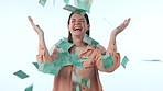 Happy woman, money rain and celebration in winning, lottery or finance savings against a studio background. Excited female person smile in cash flow, euro bills or paper falling in financial freedom