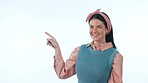 Pointing, direction and face of woman in studio with mockup space for marketing or advertising. Happy, smile and portrait of young female model from Canada with show hand gesture by white background.