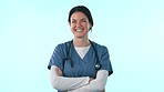 Happy studio nurse, arms crossed and woman pride in medical career, hospital support or cardiology work. Clinic services, healthcare portrait and wellness expert, doctor or surgeon on blue background