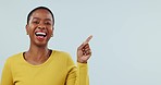 Face, woman and laugh in studio for advertising deal, information and news on white background. Portrait of happy african model pointing to mockup space, discount offer or funny announcement about us