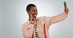 Peace hands, kiss and black woman with selfie in studio for thank you, smile or sign up, app or vote on grey background. Smartphone, profile picture and African lady influencer show support v emoji