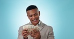 Business man, smile and counting money in studio for financial freedom, success and lottery win. Rich, calculate cash and African person with euros or prize isolated on a blue background mockup space