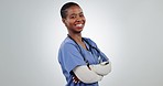 Black woman, nurse with arms crossed and face in studio, health and wellness with help and medicine on white background. Confidence, medical professional and smile in portrait with healthcare