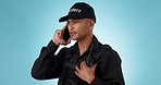 Security guard, studio phone call and man talking, consulting or discussion for protection service. Cellphone, speaking and bodyguard for justice, danger or contact law enforcement on blue background