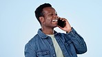 Happy black man, phone call and laughing for funny joke or conversation against a studio or blue background. African male person smile and laugh while talking on mobile smartphone for fun discussion