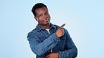 Man, hand and pointing for choice in studio with mockup for presentation of decision on blue background. African person, doubt and advice with news of discount, sale or announcement with promotion