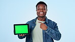 Black man, tablet green screen and presentation mockup of website, information or e learning sign up in studio. Face of african student pointing you, digital education or marketing on blue background