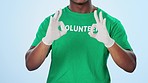 Gloves, volunteer and ok sign for success in studio isolated on a blue background. Hands, okay and man preparing for volunteering closeup, community service excellence and support for charity or NGO