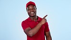 Delivery guy, space or pointing to offer, discount or distribution promotion on blue background. Face of happy black man, wrong choice or mockup for post service, sale or product placement in studio