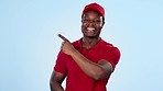 Black man, delivery and pointing in advertising, marketing or review against a studio background. Portrait of African male person or courier guy showing recommendation, feedback or choice on mockup