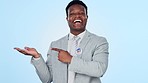 Black man, face and hand pointing in studio with vote, promo or product placement on blue background. Government, politics and portrait of African male politician show news, space or platform offer