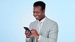 Phone, chat and happy business man in studio for social media, text or networking on blue background. Smartphone, app and African male entrepreneur laugh and meme, text or email, post or gif comic