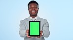 Face, green screen and black man with a tablet, business and employee on a blue studio background. Portrait, African person and model with tech, promotion and digital app with connection and internet