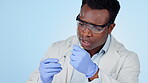 Science, man and needle in studio for vaccine, medical research, medicine solution or container with shot. Injection, scientist or black person for healthcare analytics on blue background or mock up