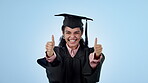 Graduation success, thumbs up or excited student in studio with education, college or university goal. Woman, hand sign or happy graduate with learning achievement or scholarship on blue background