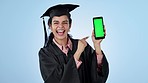 Graduate, presentation and woman face with green screen, phone and hand pointing in studio on blue background. Education, portrait and excited student with smartphone agreement or elearning platform
