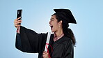 Selfie, celebration and woman with a degree, graduation and wink with certificate on a blue studio background. Person, model and student with a smartphone, social media and post with education or joy
