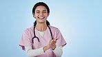 Nurse, applause and success, woman in healthcare and face, support and trust on blue background. Thumbs up, yes and cheers for medical treatment, celebration and win for health profession in studio