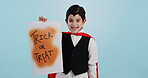 Halloween, poster and portrait of child with paper board for candy isolated in a studio blue background and happy. Holiday, laughing and kid in vampire costume for celebration in fantasy festival