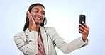 Phone, selfie and business woman in a studio with positive, confident and good attitude. Happy, smile and young Indian female lawyer taking a picture with peace sign on cellphone by white background.