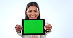 Business woman, face and tablet with green screen, mockup or presentation on tech in studio white background. Happy, portrait and Indian employee with mobile app, display and website on social media