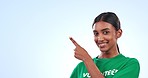 Happy woman, volunteer and pointing to mockup in advertising or marketing against a studio background. Portrait of female person smile and showing notification for donation, list or information 