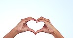 Woman, heart hands and love for care, support or trust with symbol or icon against a studio background. Closeup of person showing shape emoji, sign or like for romantic gesture on mockup space