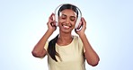 Happy woman, headphones and dancing to music, podcast or songs against a studio background. Female person smile with headset listening and enjoying audio streaming, sound track or album playlist