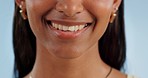 Woman, mouth and smile closeup with oral hygiene, cleaning and teeth with dermatology. Female person, lips and orthodontics with a happy model and skincare with dental wellness in blue background