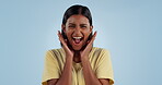 Excited, face and a shouting woman for success, celebration or a winner on a studio background. Happy, smile and portrait of an Indian girl or person with expression of surprise or hearing good news