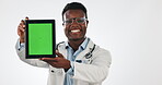 Doctor, tablet green screen and happy black man with online UI, hospital contact info or studio medicine report. Communication, mockup space and portrait surgeon show wellness news on blue background