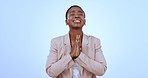 Portrait of nervous businesswoman in studio, praying in faith and opportunity for news announcement. Prayer for results, stress in job or deal, black woman with hope hand gesture on blue background.