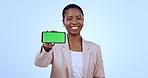 Portrait of black woman with phone, green screen and smile in studio for mobile app, website info or social media. Happy businesswoman, smartphone or chromakey in networking on blue background mockup